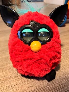 Red Furby Plush Electronic Toy with Teal Accents